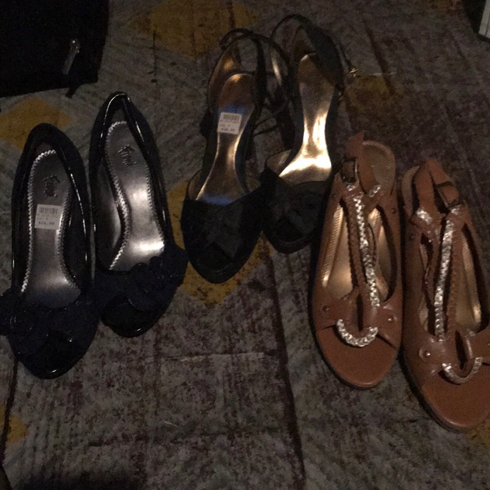 Three pair of pumps.  2 with peep toes.